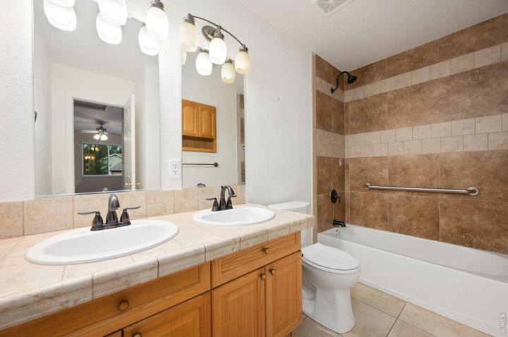 Primary bath with a double vanity and tub-shower